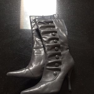 High heel boots with buttons